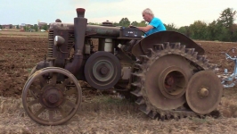 Semi-tracked hot bulb tractor plowing On Board