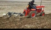 Little Tractor and adjustable 3 bottom plow